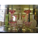 A pair of Cranberry glass spill vases, 32cm high, and other Victorian coloured glass vases and a