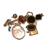 A collection of jewellery to include two gold back and front lockets, two seals, a cameo, etc