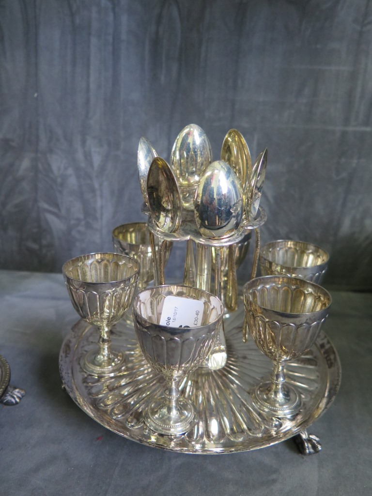 A silver plated egg cup on stand