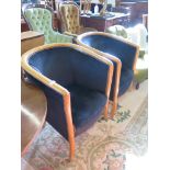 A pair of ash tub armchairs, with black upholstery on outsplayed legs (2)