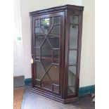 A George III style mahogany corner cabinet, with astragal glazed door and sides, 70cm wide, 95cm