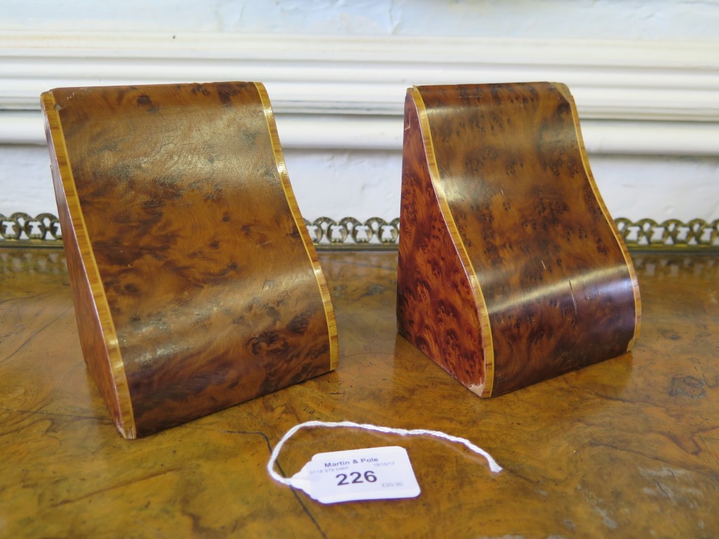 A pair of Edwardian birds-eye maple book ends, 12.5cm