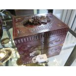 A Black Forest carved wooden box, the lid carved with grapes 21cm x 16cm