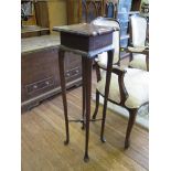 An Edwardian mahogany torchere stand, the shaped square top on straight cabriole legs with club feet