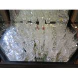 Two cut glass decanters and various drinking glasses