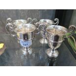 Four small trophy cups 'Replica 12 of the Wilcox Challenge Cup Won by W.E. Pitt 1928, 1933, 1934,