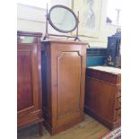 An Edwardian oak cabinet with single panelled door with gilt highlights 58cm wide 116cm high