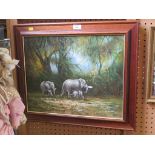 H. Carlton Elephants walking through a forest Oil on canvas Signed, 40cm x 50cm