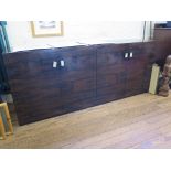 A faux rosewood sideboard, of rectangular form with two pairs of cupboard doors enclosing glass