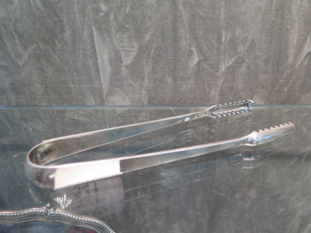 A pair of sterling silver ice tongs