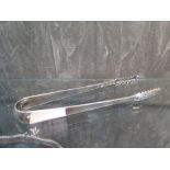 A pair of sterling silver ice tongs