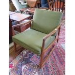 A teak rocking armchair labelled France & Son, Denmark