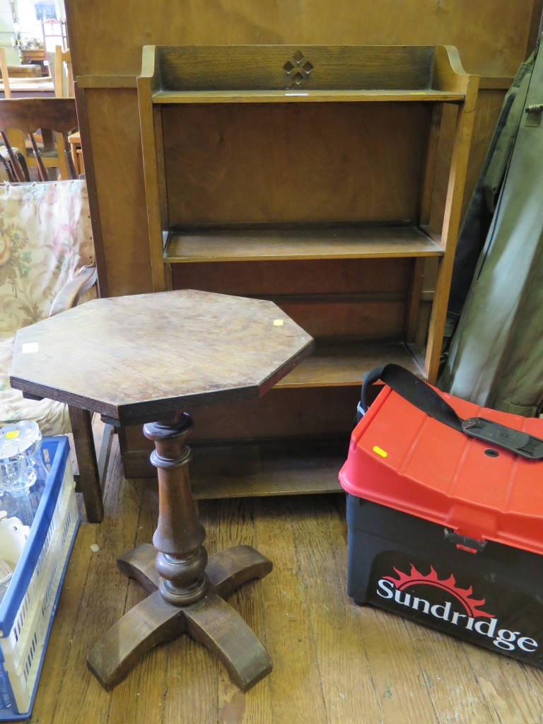 An oak octagonal table, 41.5cm wide, an oak open bookcase and an armchair (3)