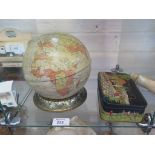 A tinplate globe and stand by Huntley, Boorne & Stevens, the stand describing principle rivers,