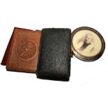 Three leather wallets, a silver photo frame, a small photo album