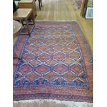 A Belouch carpet, with all over serrated medallion design in blue, red and bown, in a multiple