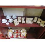 A fifteen piece porcelain dolls' tea service in original lidded box, a doll's part tea service and a