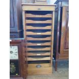 An oak tambour front filing cabinet, with nine slides (one slide later) 48cm wide, 112cm high (