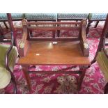 A late Victorian mahogany hall stool, with brass mounts, stamped Jas. Shoolbred & Co. and numbered