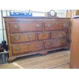 A George III oak and mahogany crossbanded mule chest, the hinged top over two dummy drawers, above