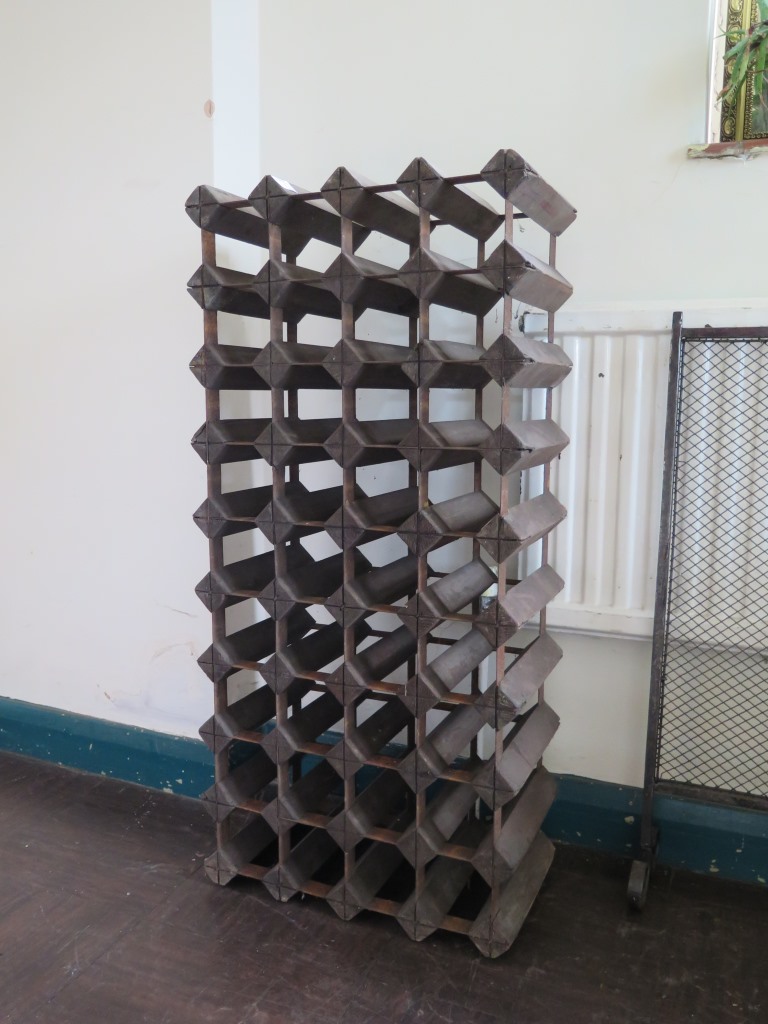 A wine rack with thirty-six compartments