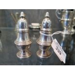 A pair of sterling silver pepperettes