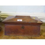 A Regency mahogany sarcophagus form tea caddy, with two caddies and bowl compartment, lacks feet,
