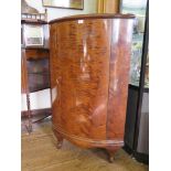 A flame mahogany corner cabinet, with single door over a shaped apron and cabriole legs, 74cm wide