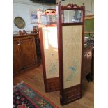 An Edwardian mahogany four fold screen, each panel with bevelled glass plate over painted silk