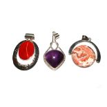 Three silver pendants
