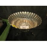 A Chinese export silver dish or bowl with three dolphin head feet, 12cm diameter