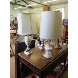 A pair of variegated grey marble table lamps, of vase form on stepped bases, 37cm high and another