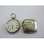 A silver key wind pocket watch and an E.P.N.S. vesta case