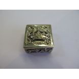 A silver pill box decorated in relief with gilded interior, marked 925