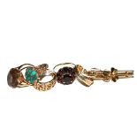 A collection of 9 carat gold rings to include garnet, turquoise, smoky quartz and three colour