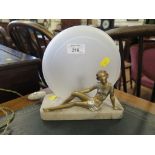 An Art Deco marble table lamp, with gilded figure of a recumbent lady 20cm long