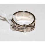 A silver buckle ring