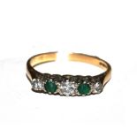 A five stone emerald and diamond ring set in 9 carat gold