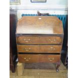 A walnut bureau with shaped top, three long drawers and cabriole legs 76cm wide