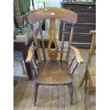 A beech and elm kitchen armchair, with baluster shape splat and turned supports