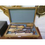 Various chisels, corkscrews and woodwork tools, in a baize lined box