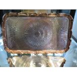 A copper rectangular tray with sunburst pattern, 40cm