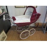 A maroon Silver Cross dolls' pram 98cm