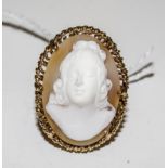 A finely carved cameo bust of a young woman set in a 9 carat gold ring