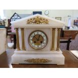 A late Victorian alabaster mantel clock, of architectural form with gilt metal mounts, the twin