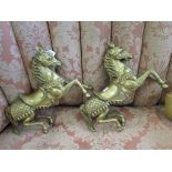 A pair of brass prancing horses with bridles and saddles, possibly Indian, 30cm high