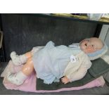 An Armand Marseille bisque doll, no 518/9K with blue sleepy eyes, open mouth and two teeth on a