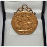 A gold £2 piece 1902 with mount