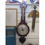 An early 19th century rosewood and mother of pearl inlaid banjo barometer with alcohol thermometer
