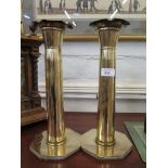 A pair of brass trench art ashtrays formed from shells, 36cm high